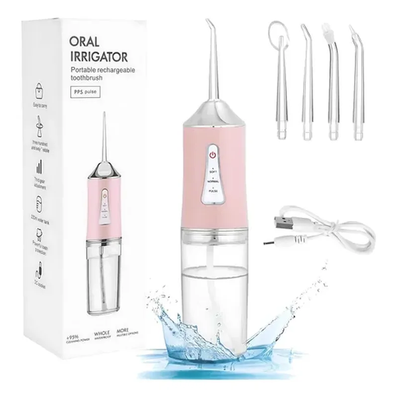 Irrigador dental blanco y rosado con boquillas intercambiables
