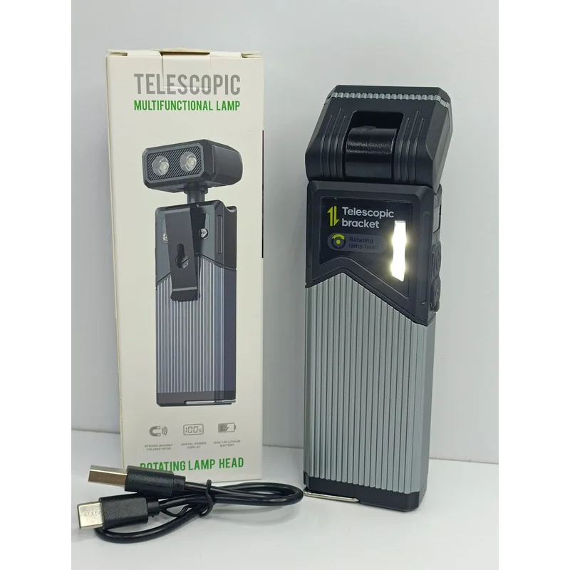Lámpara LED telescópica gris con cabezal giratorio junto a su caja