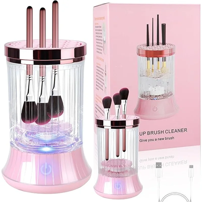 Limpiador eléctrico de brochas rosado con brochas dentro del recipiente