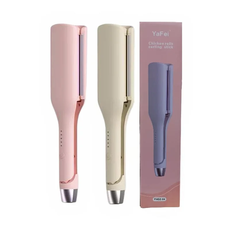 Onduladores de pelo en tonos rosado y crema junto a su caja